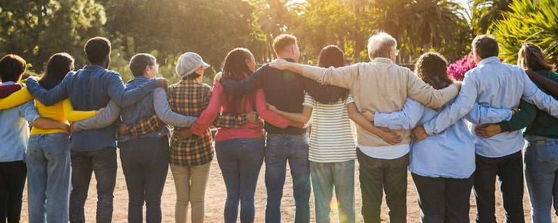 Multi-generational family embracing at Skypoint Senior Living